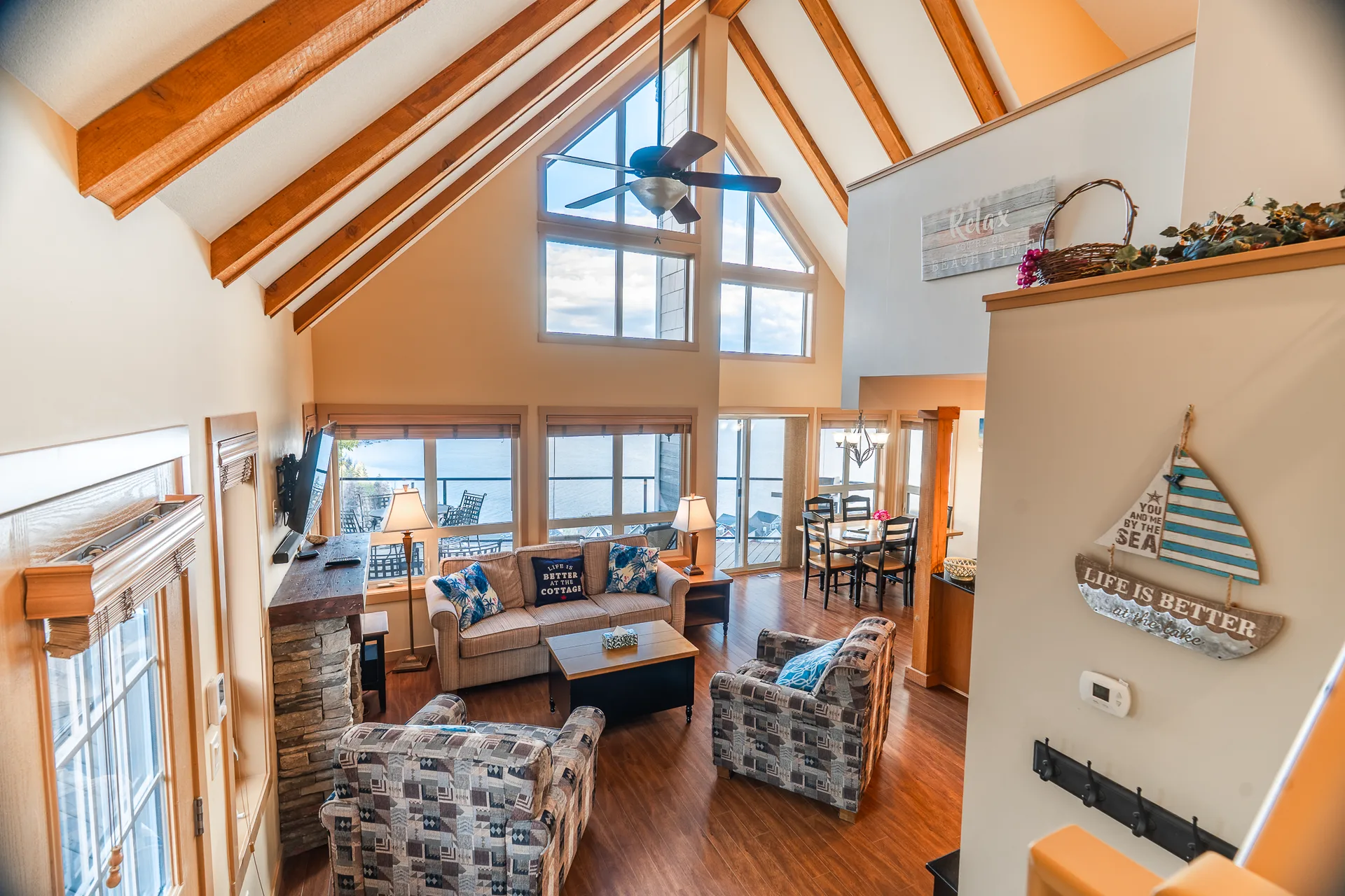 Living room from above with lake view through windows